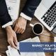 Market Volatility Can Stir Your Loss Aversion, camera looking down on desktop with papers, computer, coffee and man's hands